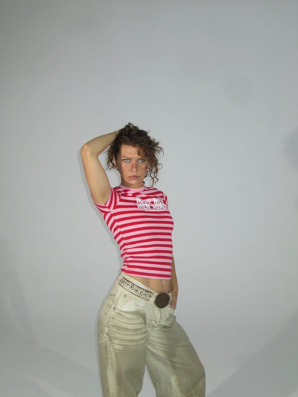 Make men men again in red-pink striped baby tee