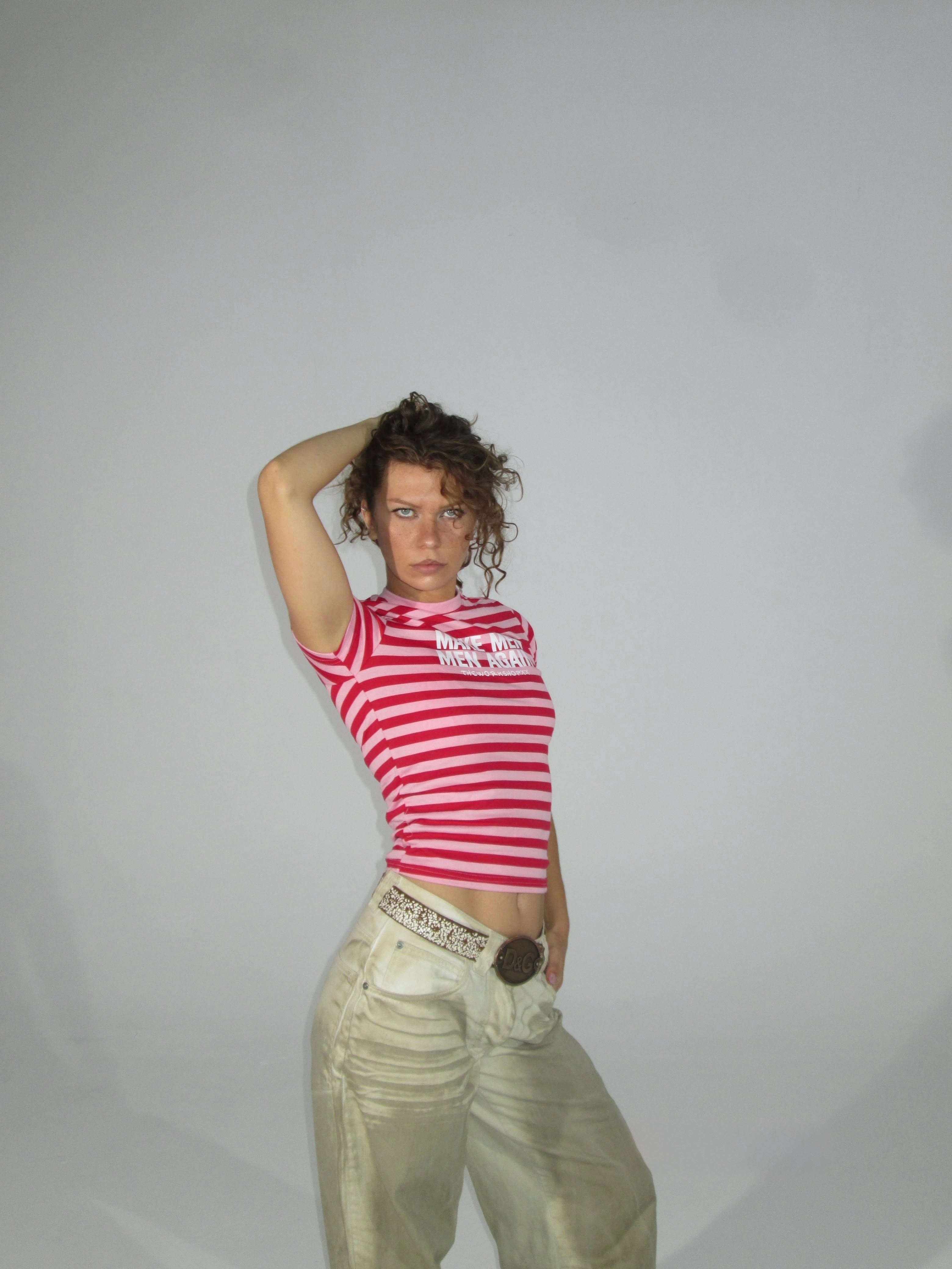 Make men men again in red-pink striped baby tee