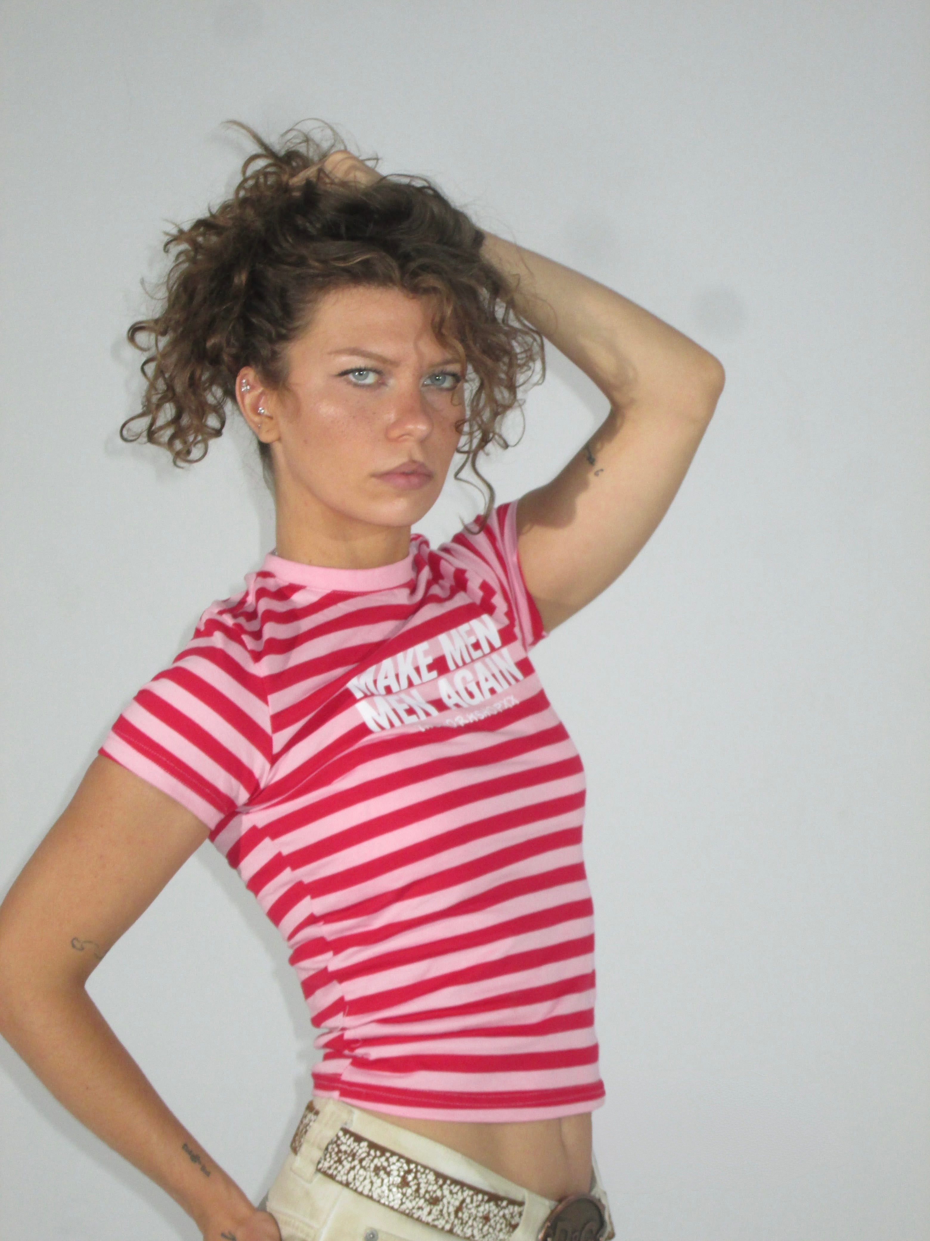 Make men men again in red-pink striped baby tee