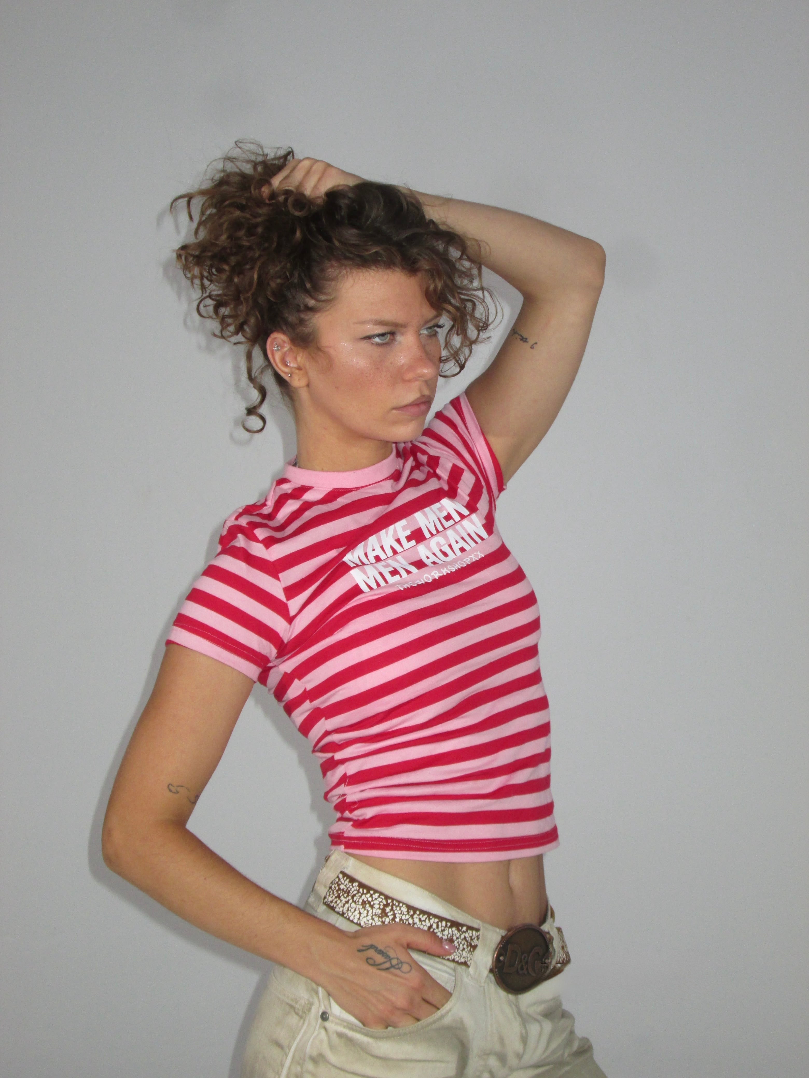 Make men men again in red-pink striped baby tee