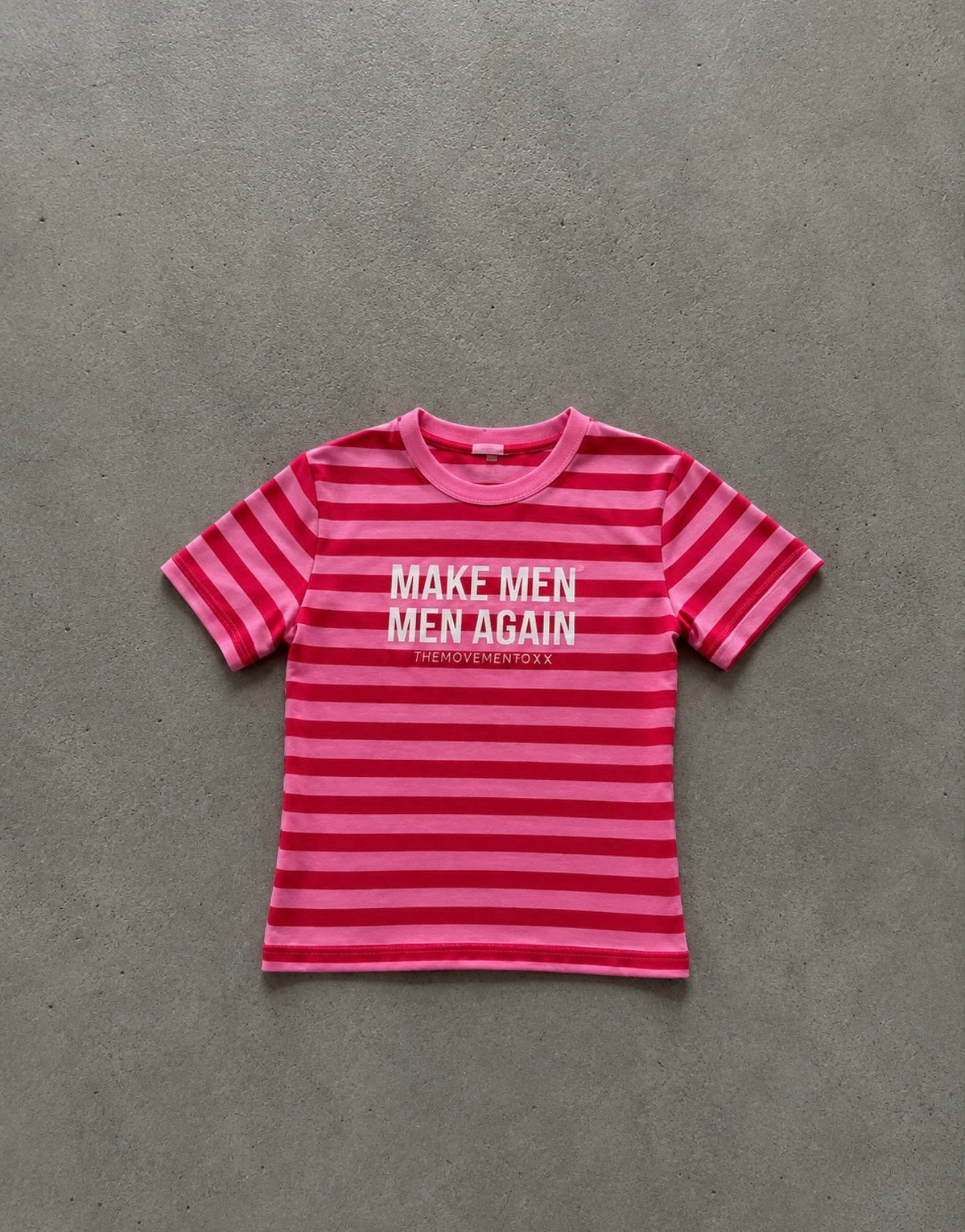 Make men men again in red-pink striped baby tee